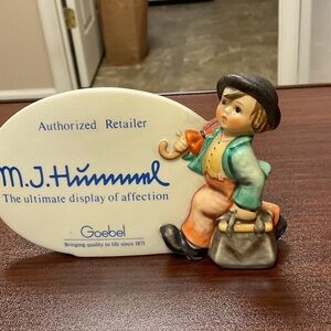 Hummel Figurine with Black Hat and Orange Accents